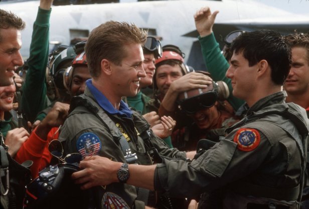 top-gun-1986-001-val-kilmer-embracing-tom-cruise